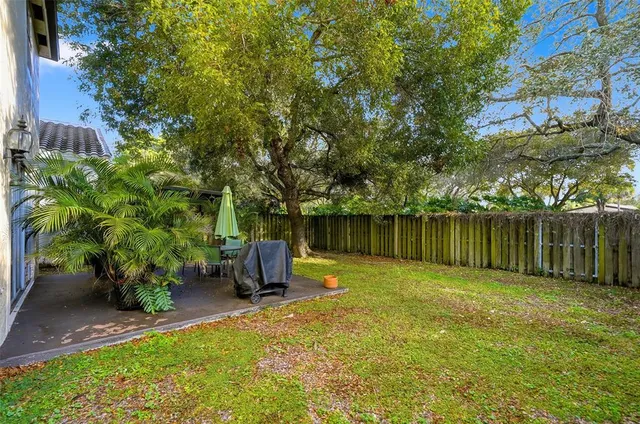 a backyard of a house with lots of green space