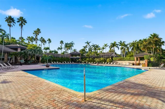 a view of a swimming pool with a lounge chairs