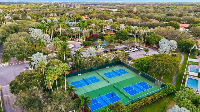 an aerial view of multiple house with yard