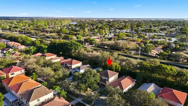 an aerial view of residential houses with outdoor space
