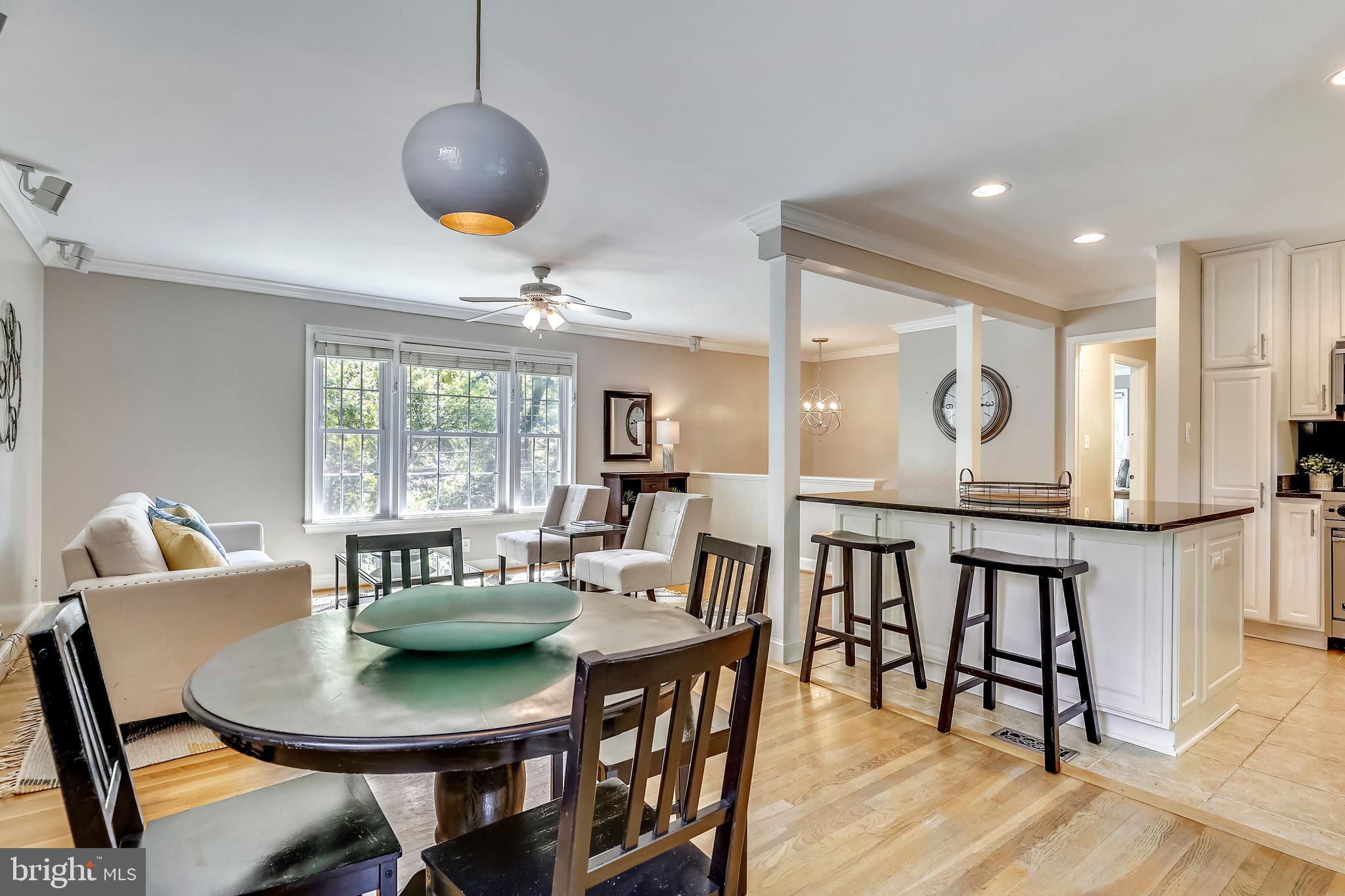 1007 West Braddock Road Alexandria, VA 22302 - Photo 8 of 55 a view of a dining room with furniture and wooden floor