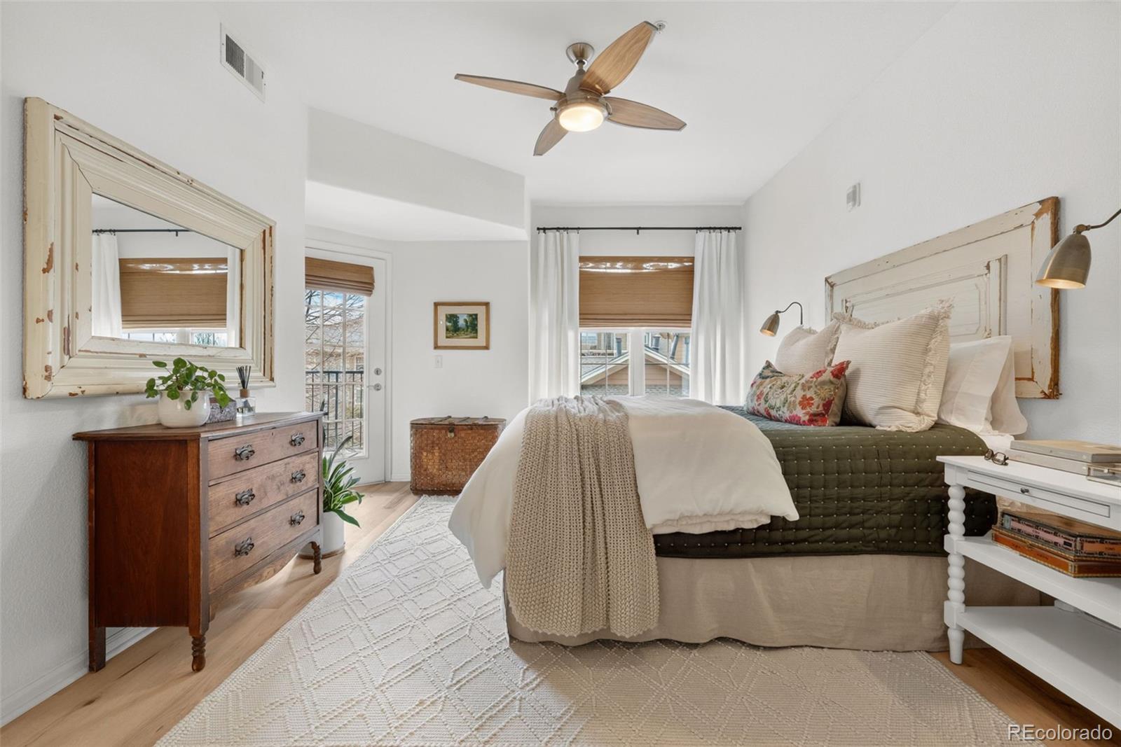 a living room with furniture and a dresser