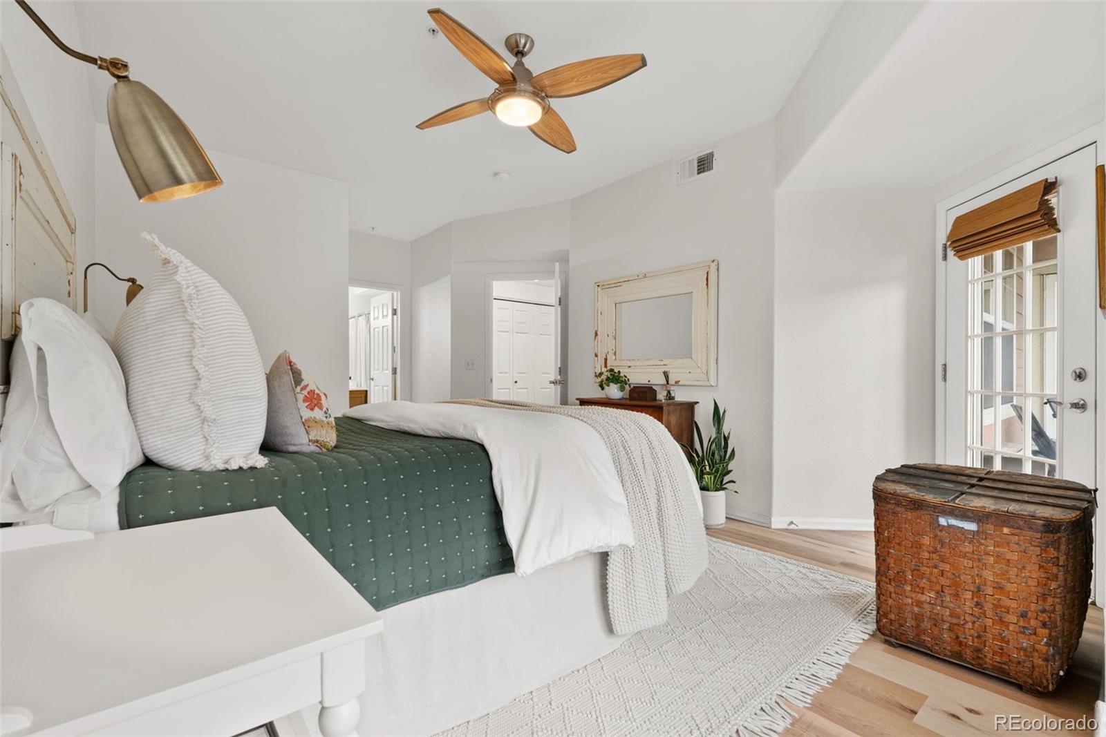 10733 Twenty Mile Road, Unit 208 Parker, CO 80134 - Photo 19 of 42 a bed room with a bed and a television