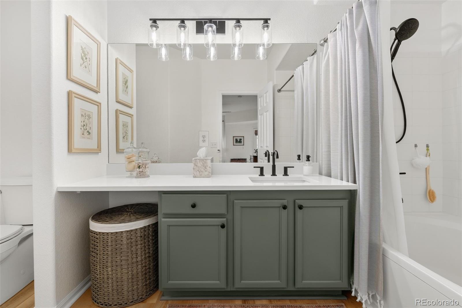 10733 Twenty Mile Road, Unit 208 Parker, CO 80134 - Photo 22 of 42 a bathroom with a sink double vanity and a mirror