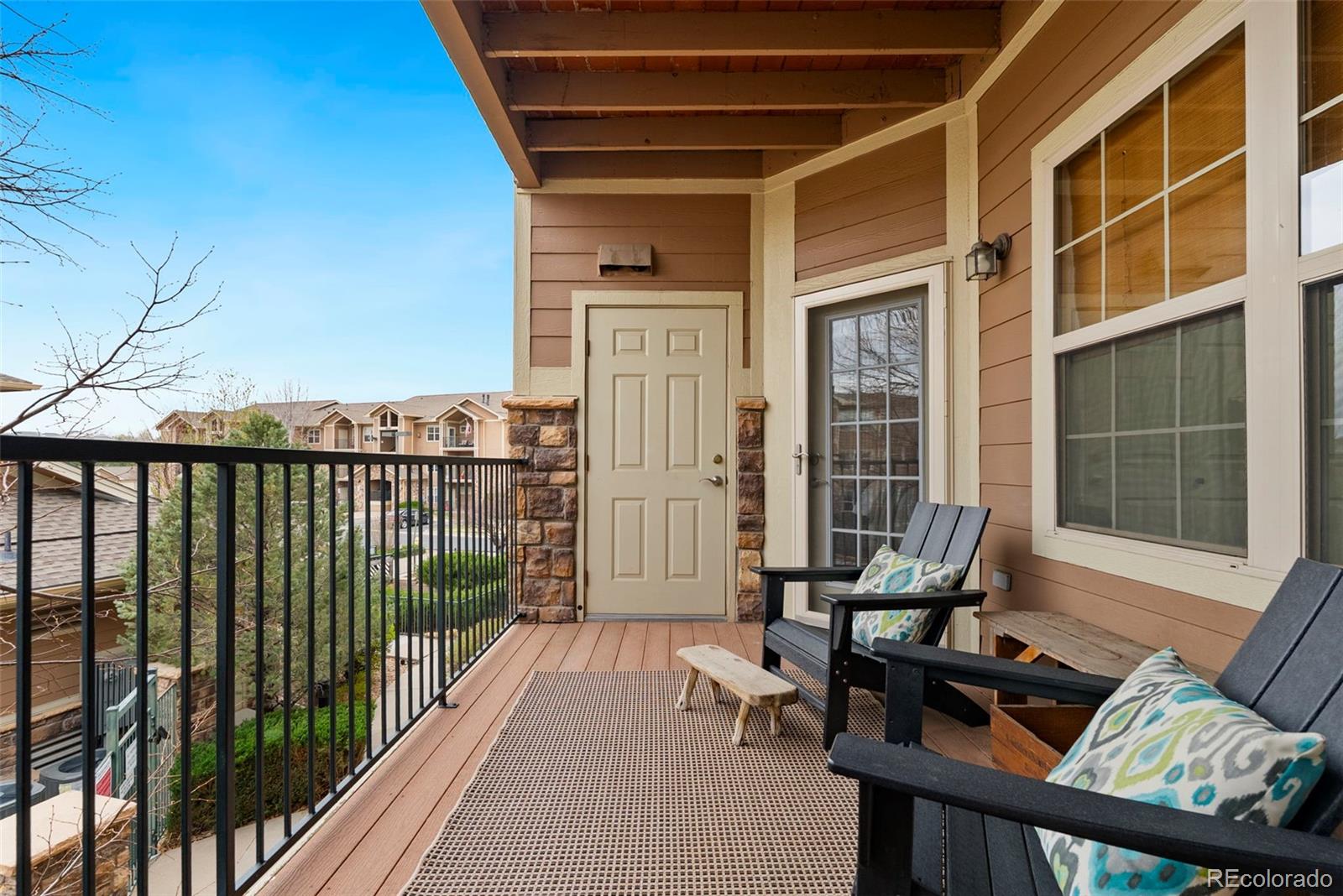 10733 Twenty Mile Road, Unit 208 Parker, CO 80134 - Photo 30 of 42 a view of balcony with couch