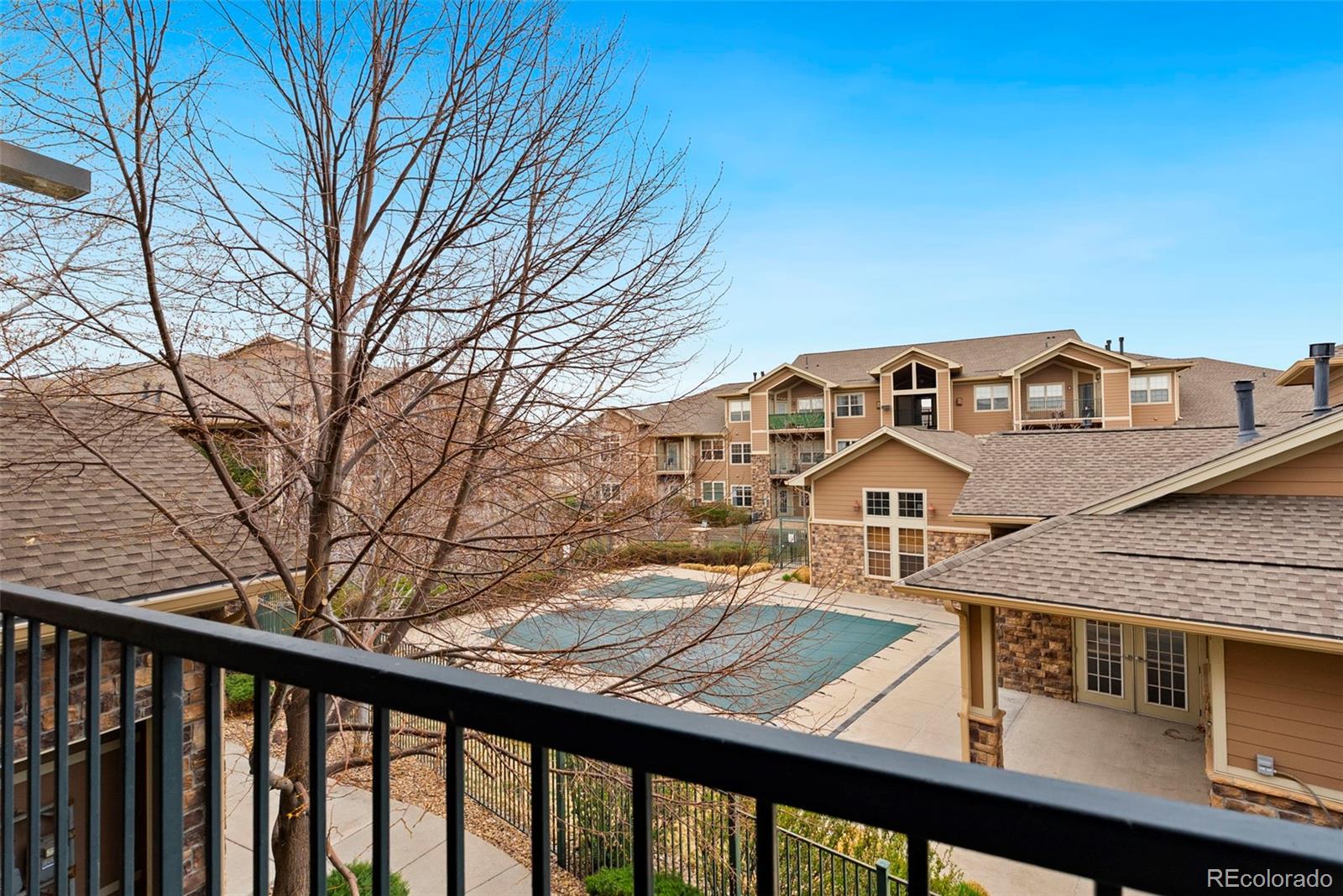 10733 Twenty Mile Road, Unit 208 Parker, CO 80134 - Photo 31 of 42 a view of a building with a balcony
