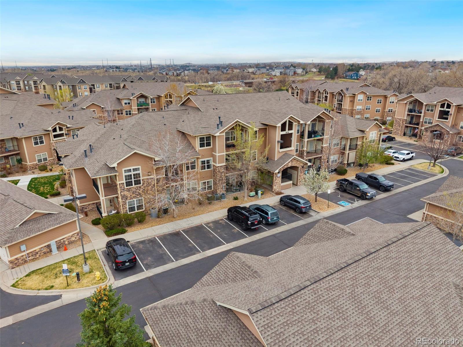 10733 Twenty Mile Road, Unit 208 Parker, CO 80134 - Photo 34 of 42 an aerial view of residential houses with outdoor space