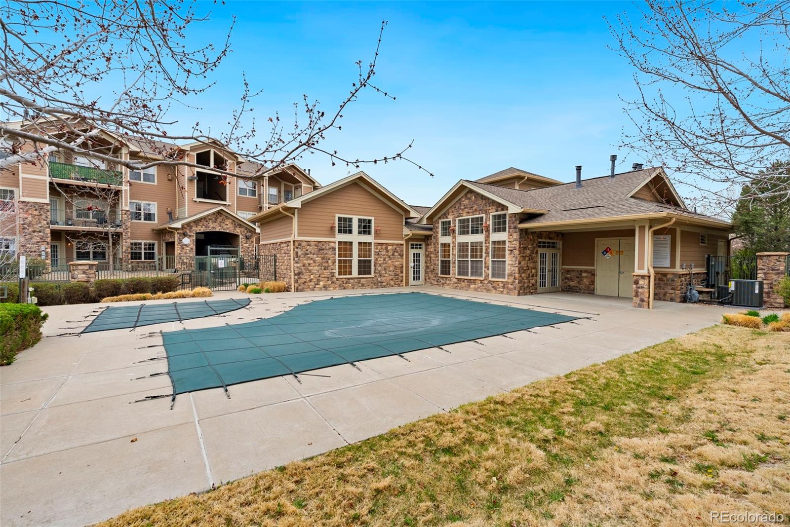 10733 Twenty Mile Road, Unit 208 Parker, CO 80134 - Photo 35 of 42 a front view of a house with a yard