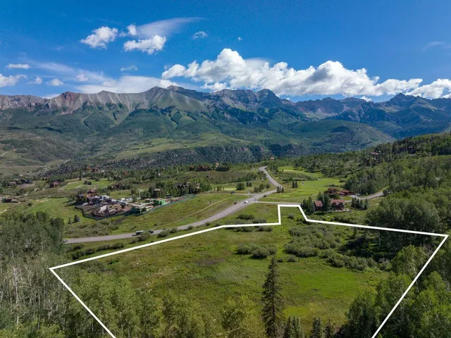 a view of a golf course with a swimming pool