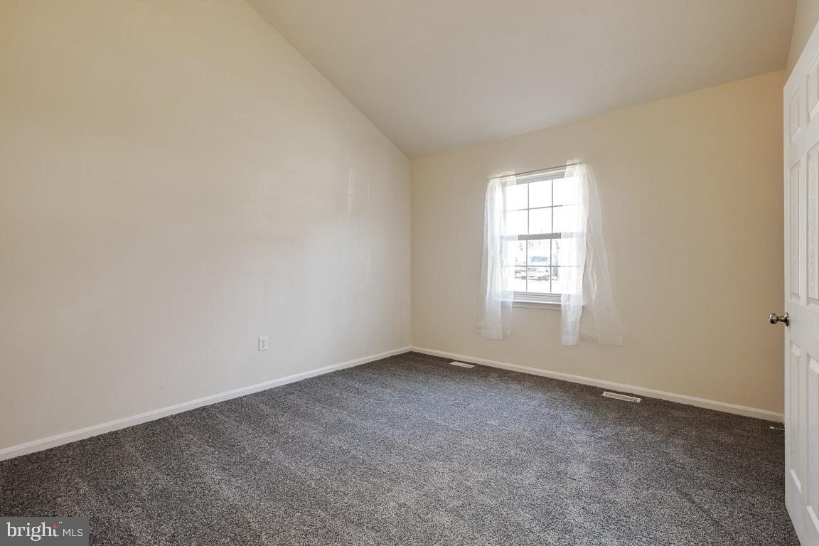 781 Rattlesnake Road Lusby, MD 20657 - Photo 22 of 30 Bedroom # 3 - soaring vaulted ceilings!
