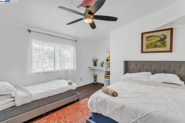 a bedroom with a bed and dresser