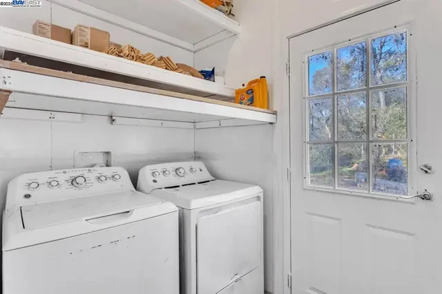 a utility room with dryer and washer