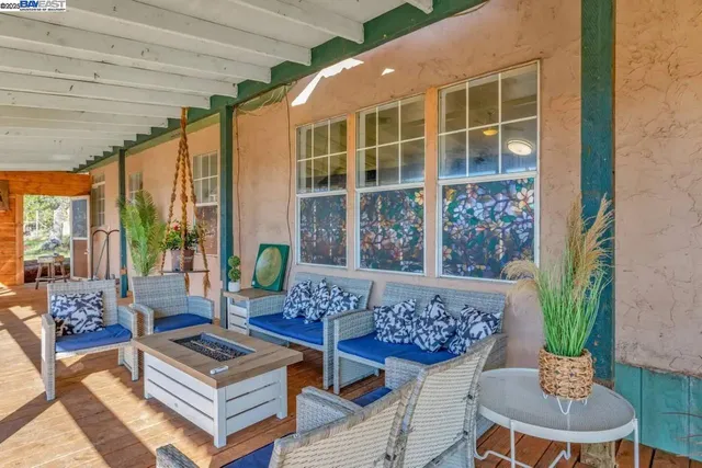 a outdoor living space with furniture and a potted plant