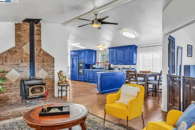 a living room with furniture a fireplace and a table