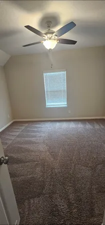 a view of a room with a fan