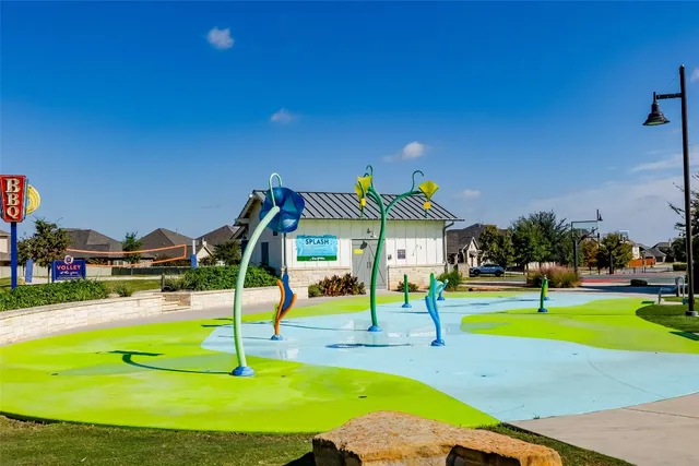 a view of a swimming pool with outdoor seating