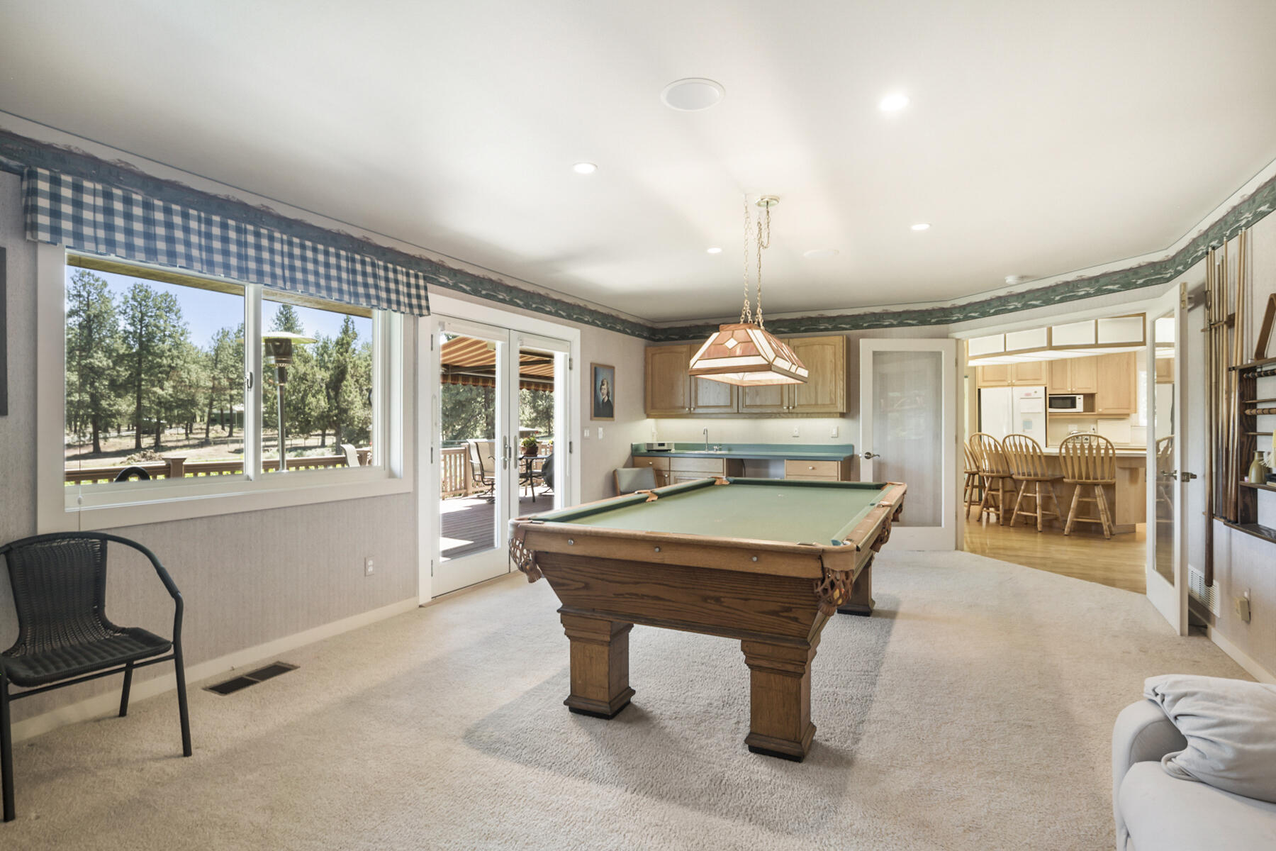 60696 Tekampe Road Bend, OR 97702 - Photo 18 of 61 a room with pool table and windows