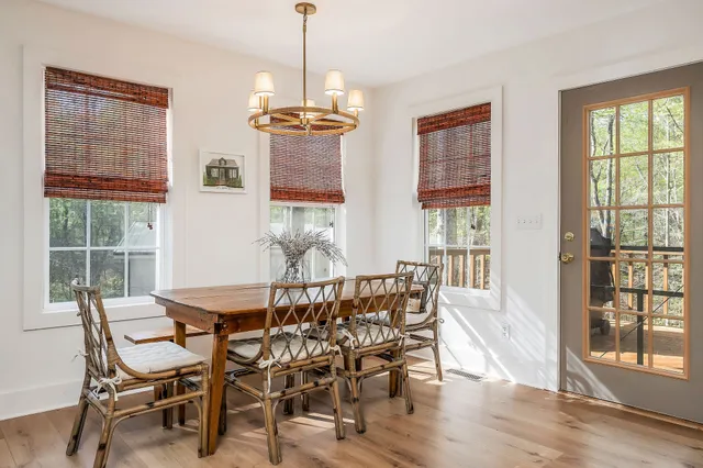 a view of a dining room with furniture and window