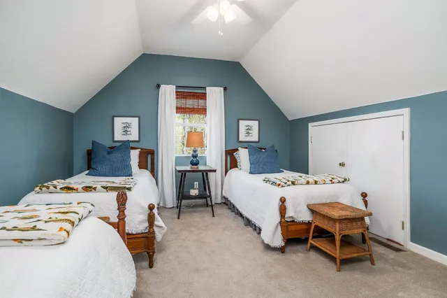 a bedroom with a bed and closet