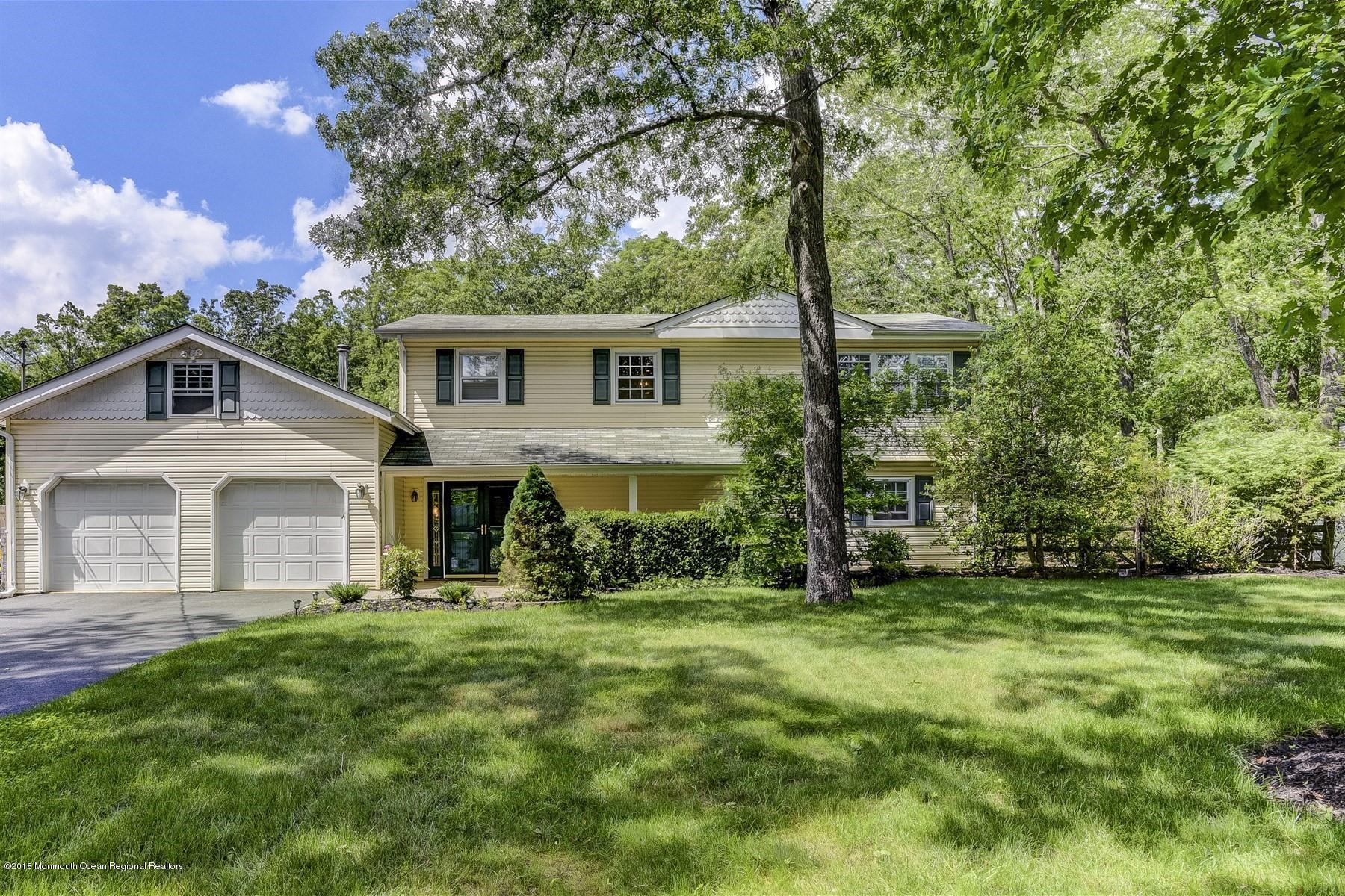 66 Thompson Bridge Road Jackson, NJ 08527 - Photo 1 of 34 a front view of house with yard and green space