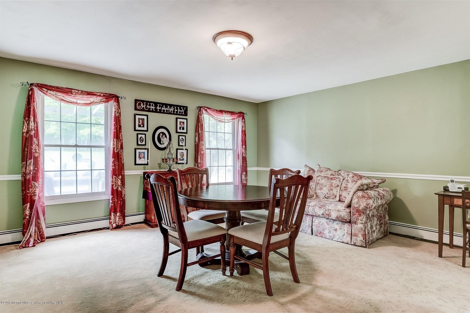 66 Thompson Bridge Road Jackson, NJ 08527 - Photo 12 of 34 a dining room with furniture and a window