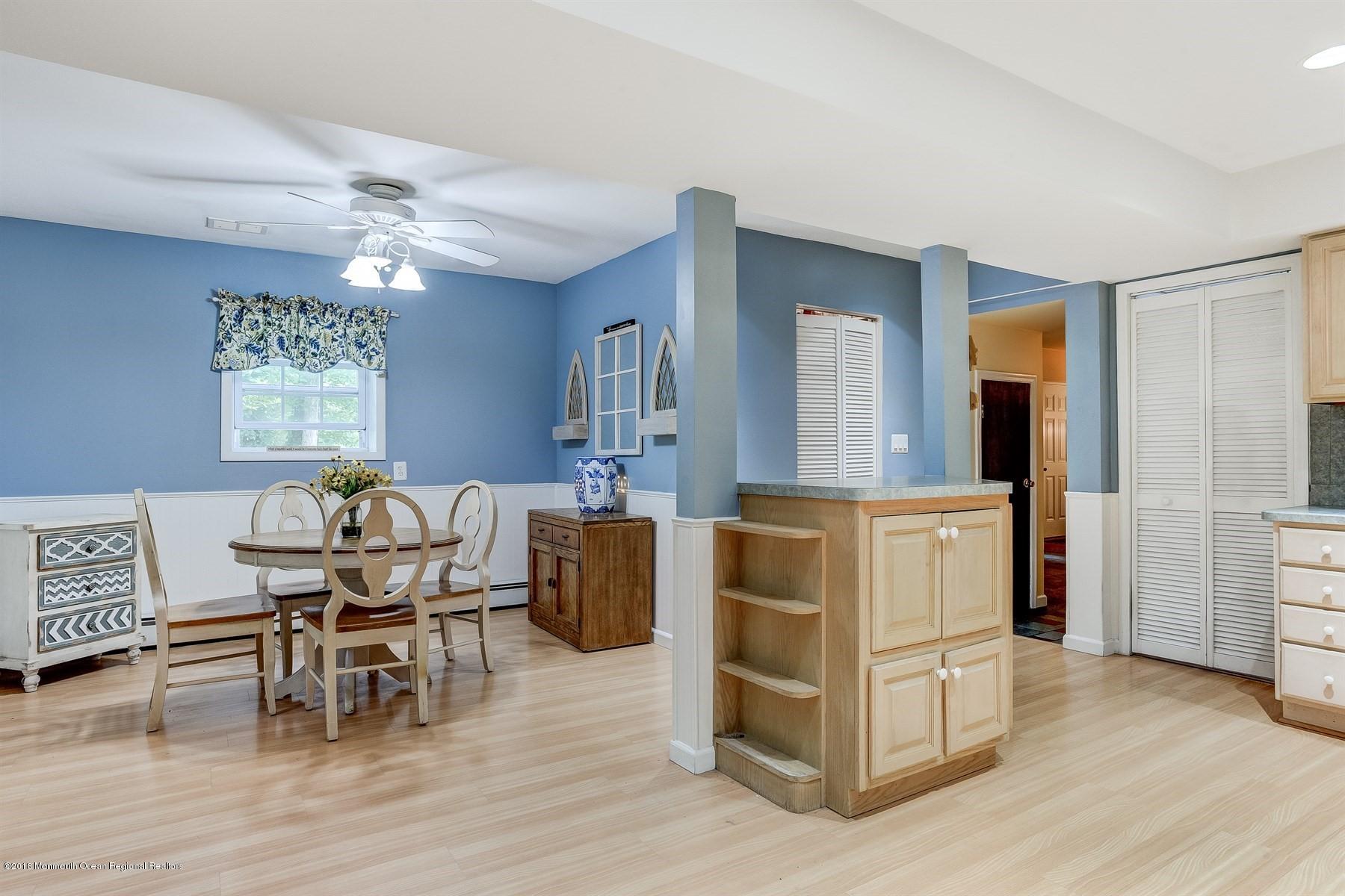 66 Thompson Bridge Road Jackson, NJ 08527 - Photo 13 of 34 a living room with furniture and a wooden floor