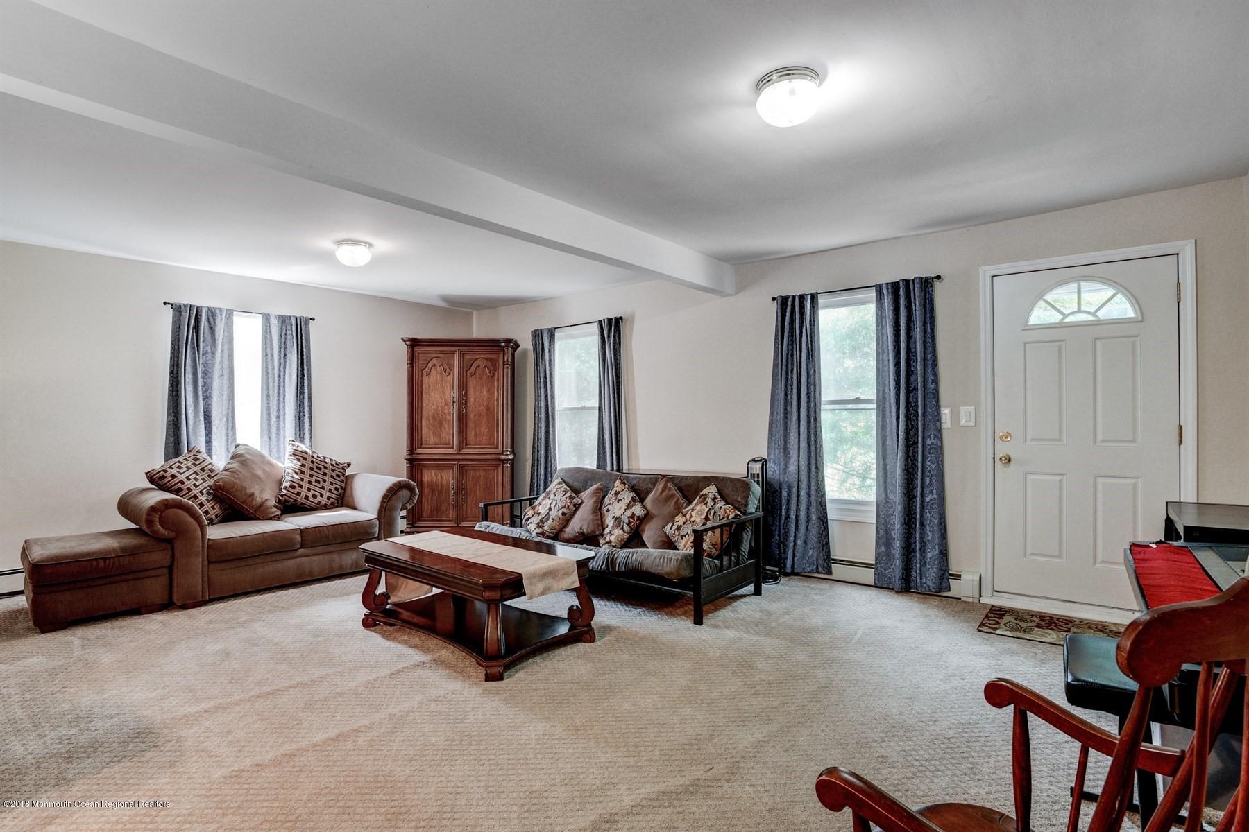 66 Thompson Bridge Road Jackson, NJ 08527 - Photo 19 of 34 a living room with furniture and a window