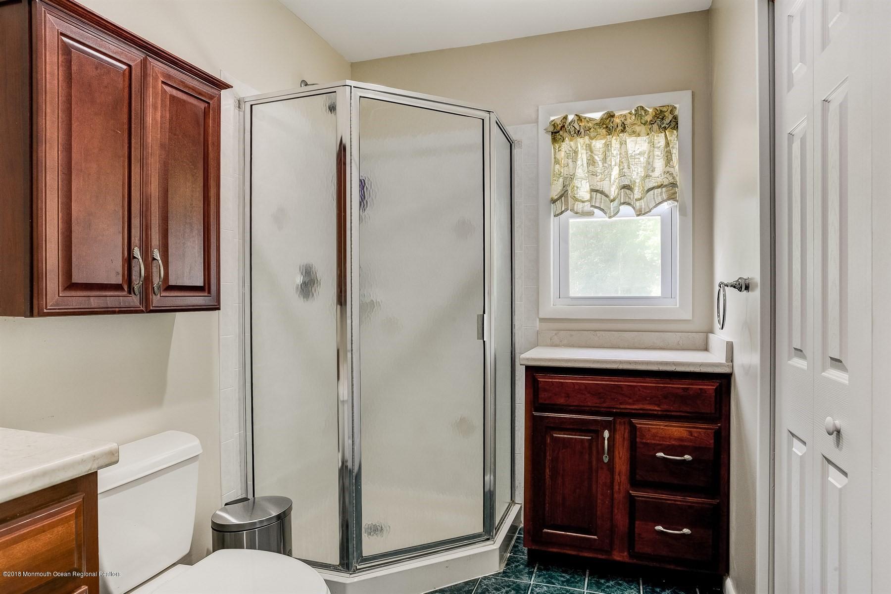 66 Thompson Bridge Road Jackson, NJ 08527 - Photo 24 of 34 a bathroom with a toilet a sink and shower