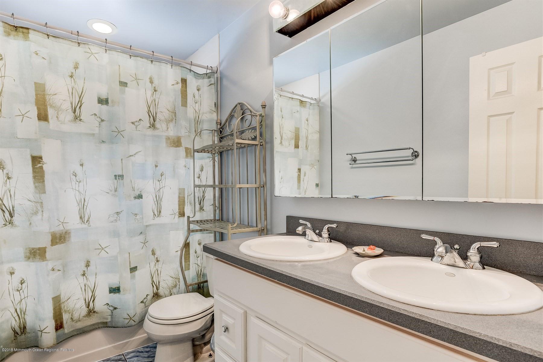 66 Thompson Bridge Road Jackson, NJ 08527 - Photo 27 of 34 a bathroom with a granite countertop sink toilet and shower