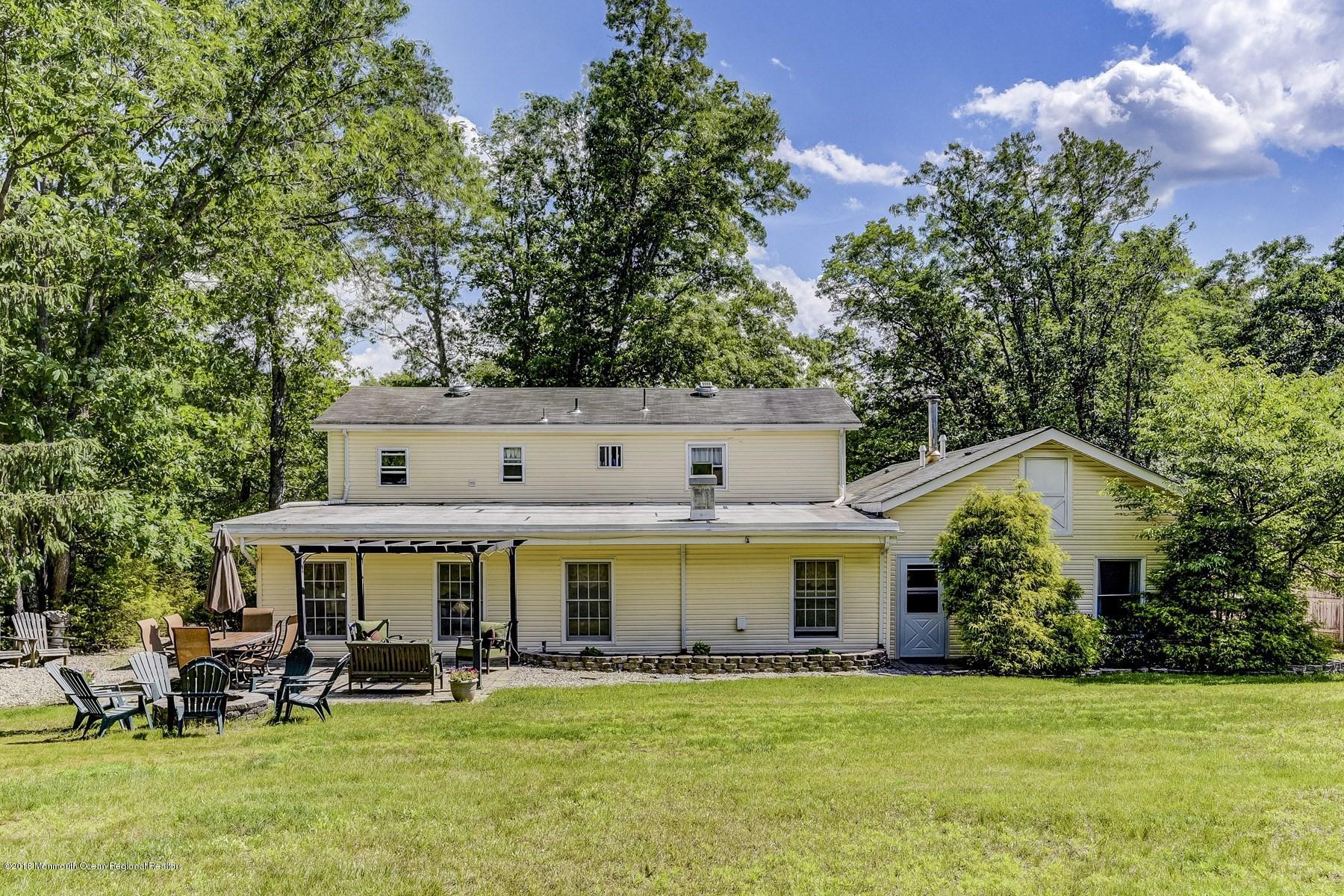 66 Thompson Bridge Road Jackson, NJ 08527 - Photo 30 of 34 a view of a white house with a big yard and large trees