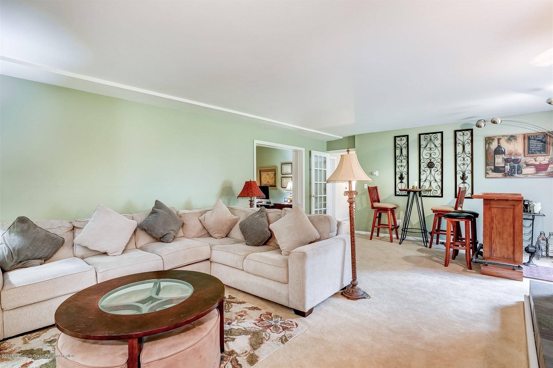 66 Thompson Bridge Road Jackson, NJ 08527 - Photo 10 of 34 a living room with furniture and a table