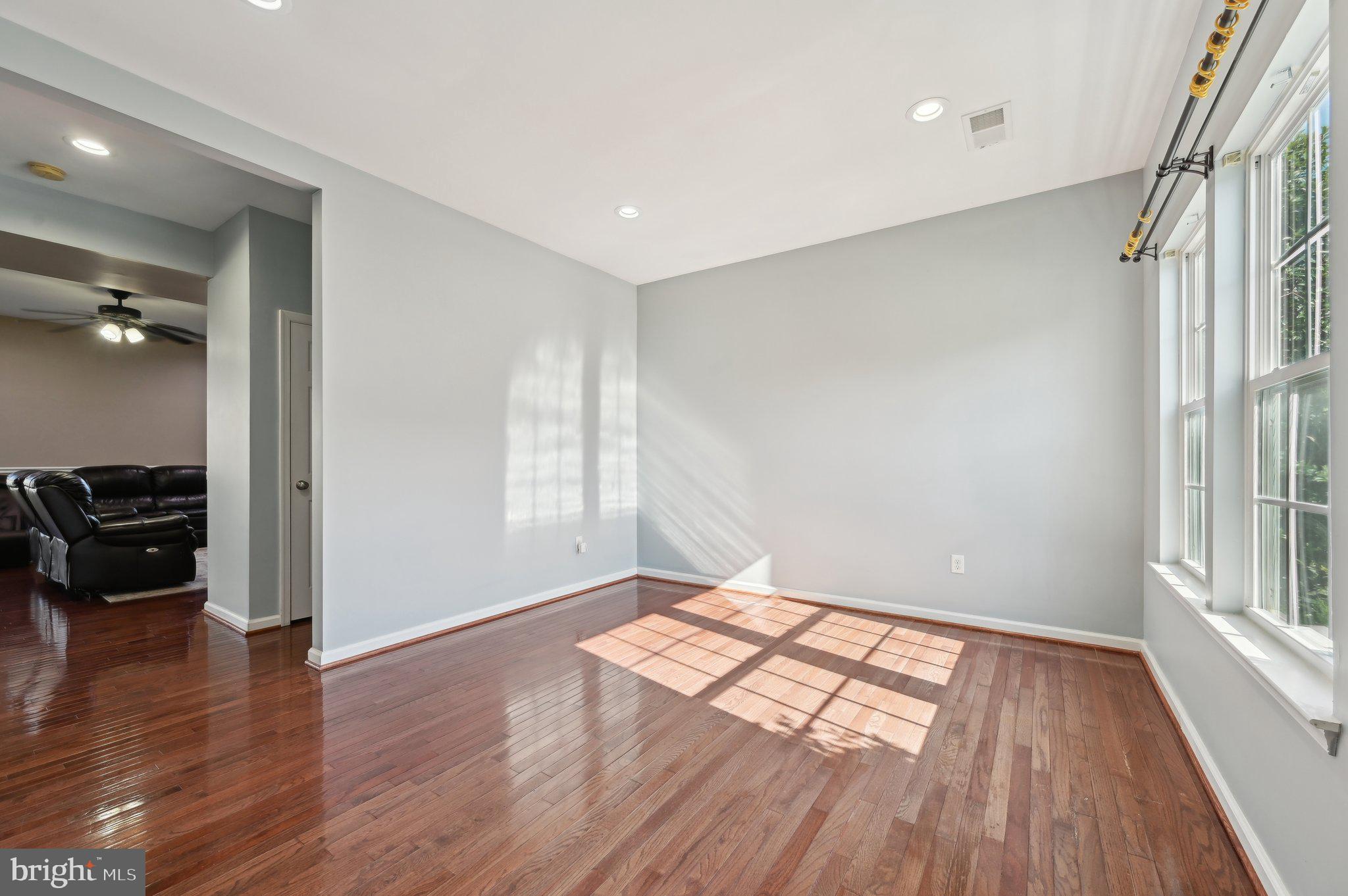 9552 Chaton Road Laurel, MD 20723 - Photo 16 of 53 wooden floor in an empty room with a window
