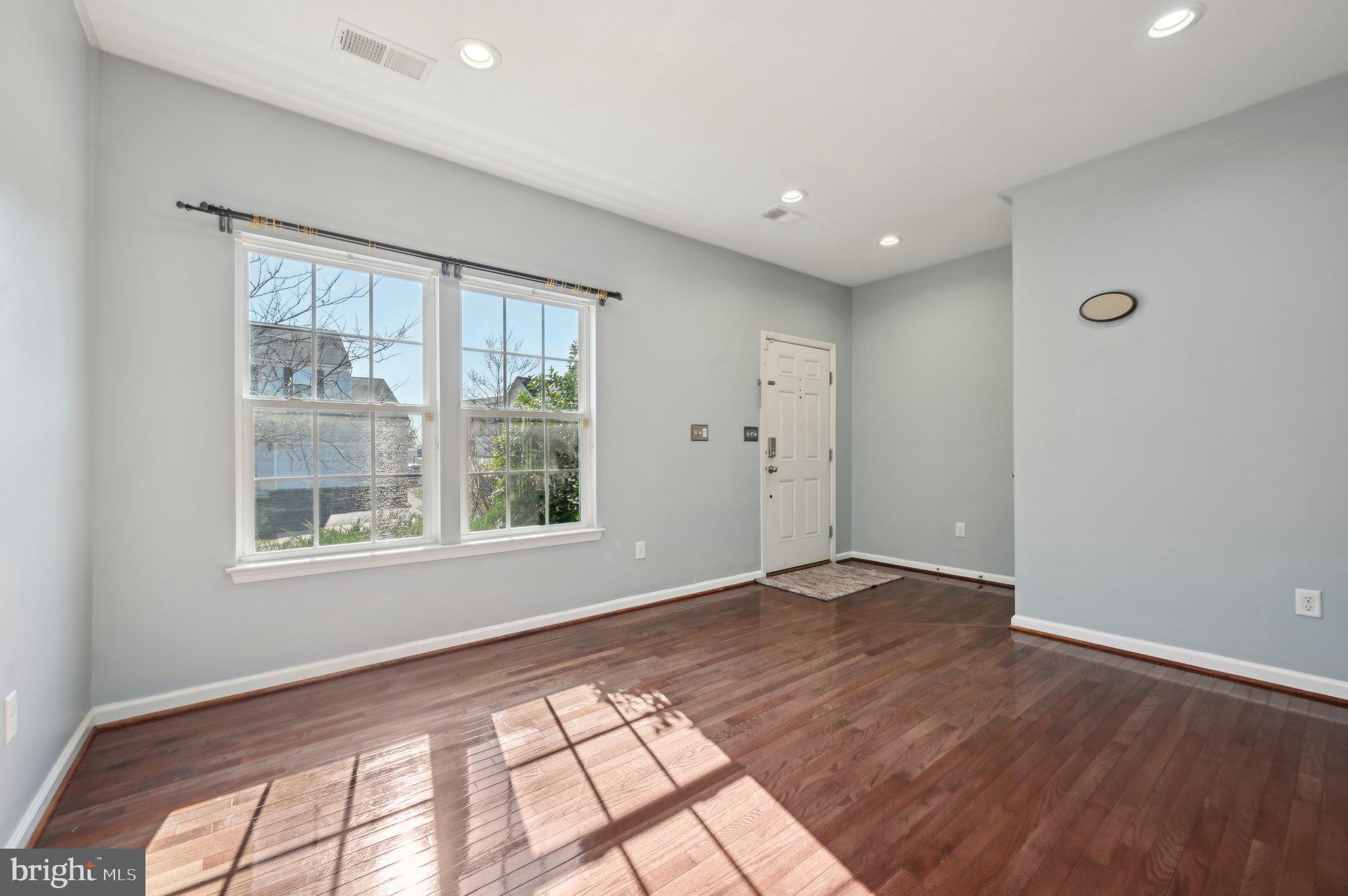 9552 Chaton Road Laurel, MD 20723 - Photo 19 of 53 a view of an empty room with wooden floor and a window