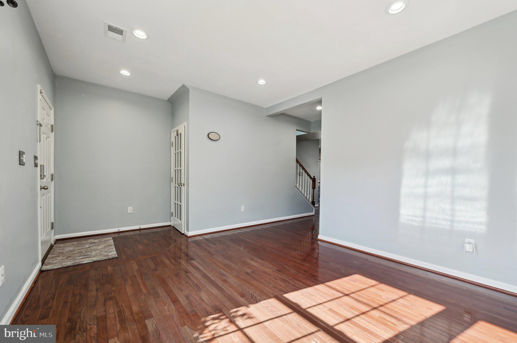9552 Chaton Road Laurel, MD 20723 - Photo 20 of 53 an empty room with wooden floor and windows
