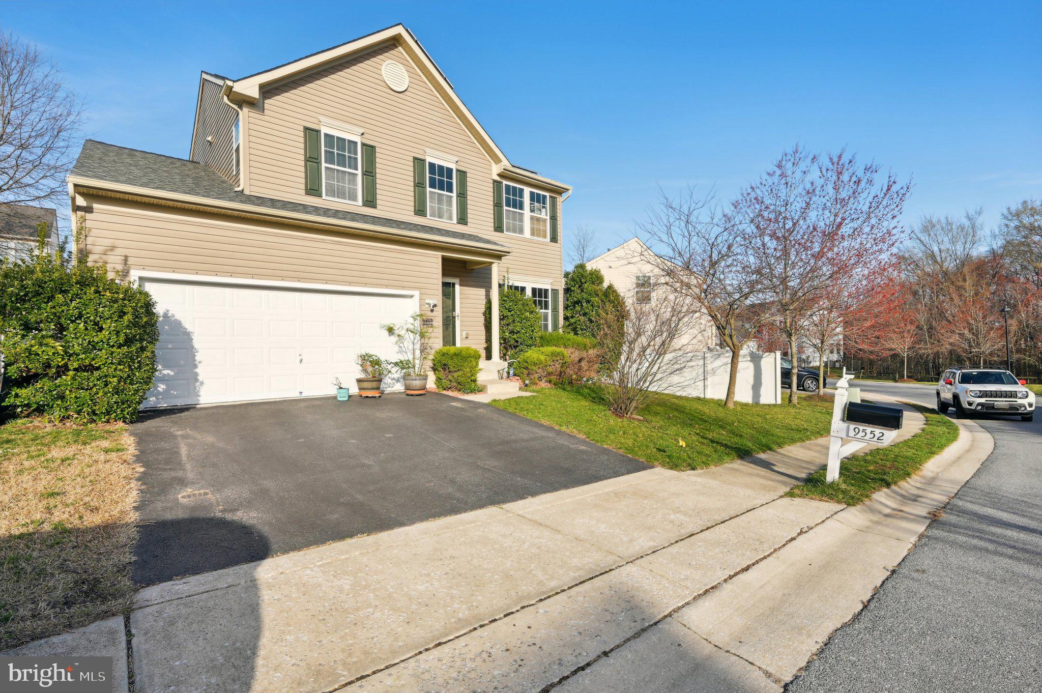 9552 Chaton Road Laurel, MD 20723 - Photo 2 of 53 a front view of a house with a yard and garage