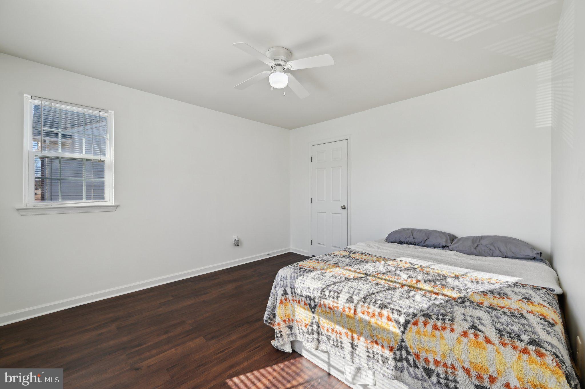 9552 Chaton Road Laurel, MD 20723 - Photo 28 of 53 a bedroom with a bed and a ceiling fan