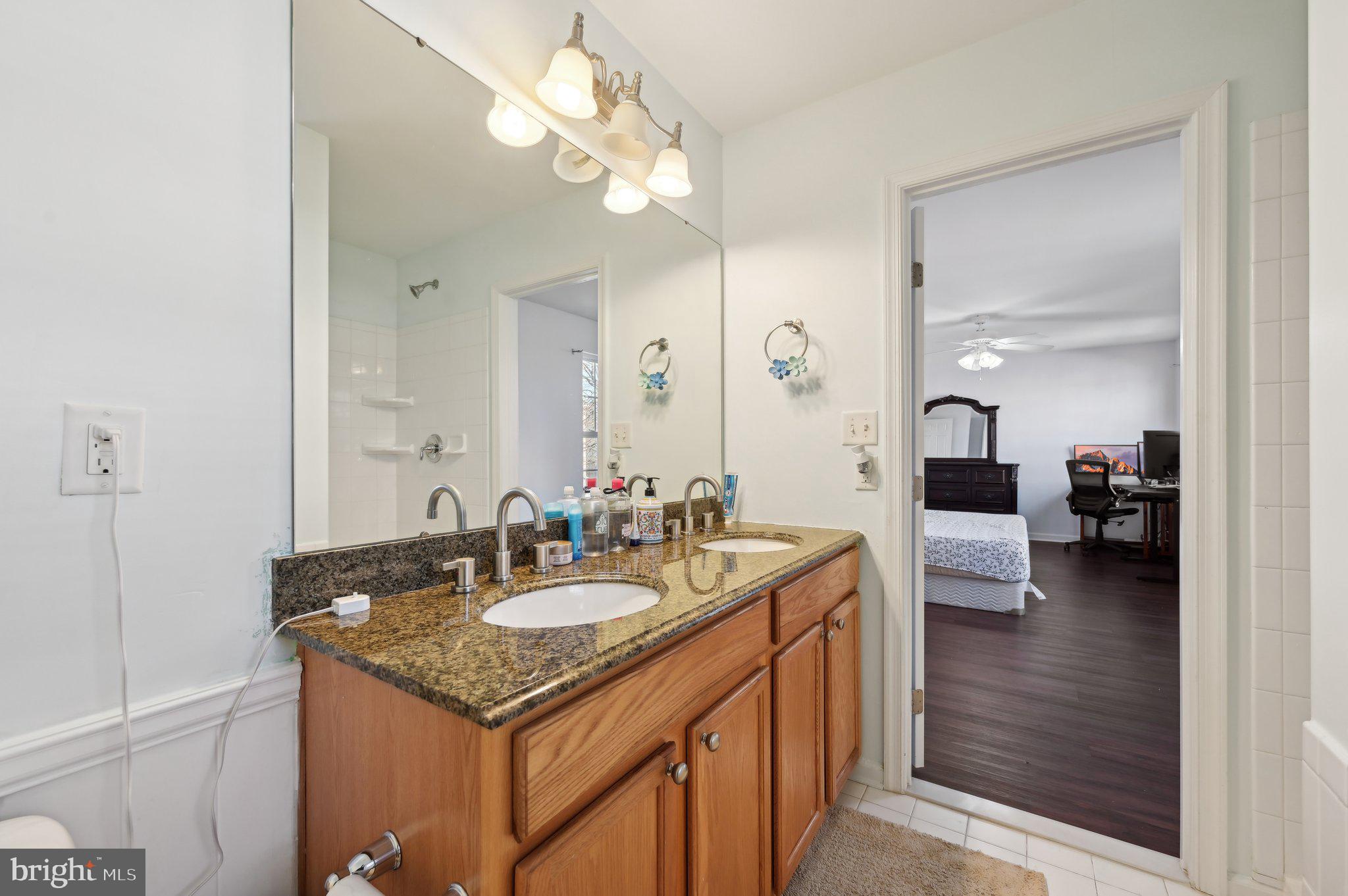 9552 Chaton Road Laurel, MD 20723 - Photo 43 of 53 a bathroom with a sink a light fixture and a mirror