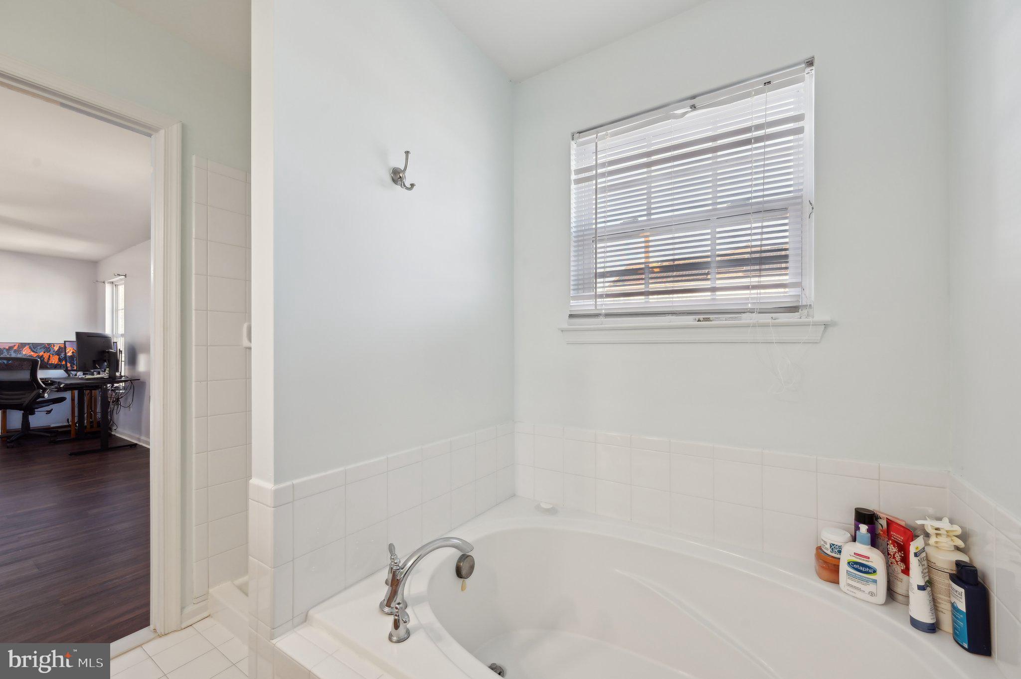 9552 Chaton Road Laurel, MD 20723 - Photo 44 of 53 a bathroom with a tub and a view of bathroom
