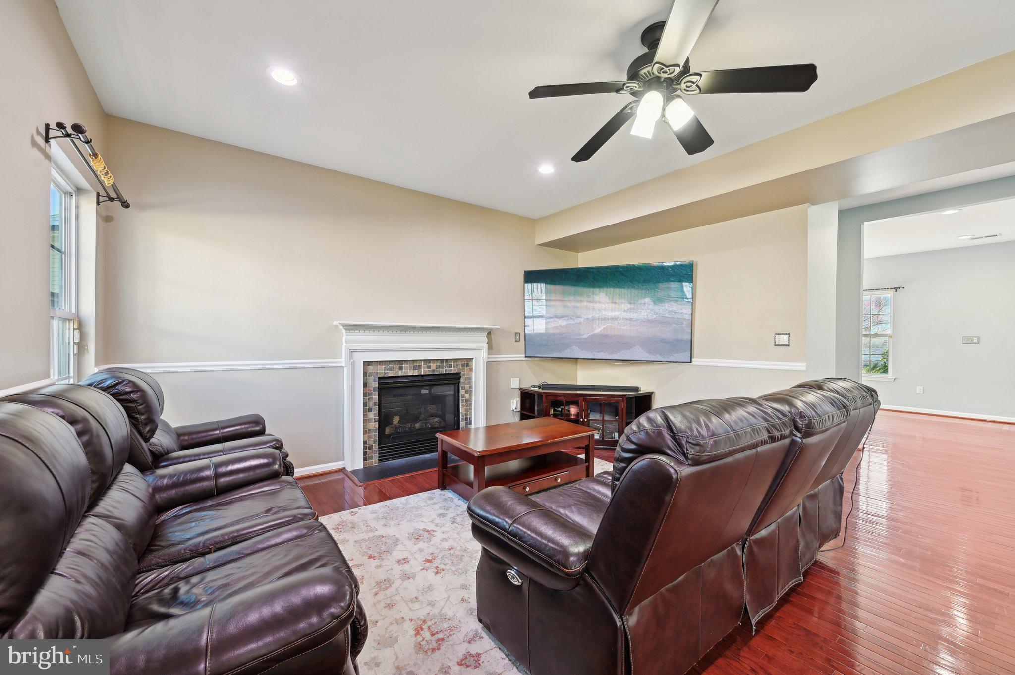 9552 Chaton Road Laurel, MD 20723 - Photo 7 of 53 a living room with furniture and a fireplace