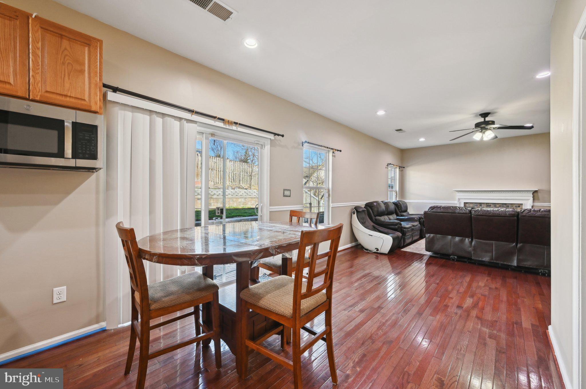 9552 Chaton Road Laurel, MD 20723 - Photo 10 of 53 a living room with furniture a wooden floor and a window