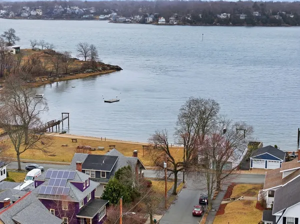 a view of a lake with a building in the background