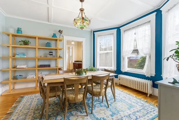 a view of a dining room with furniture window and wooden floor