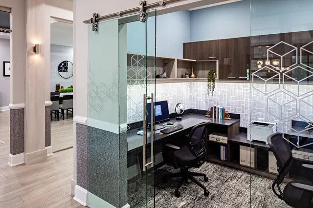 a living room with furniture rug and window
