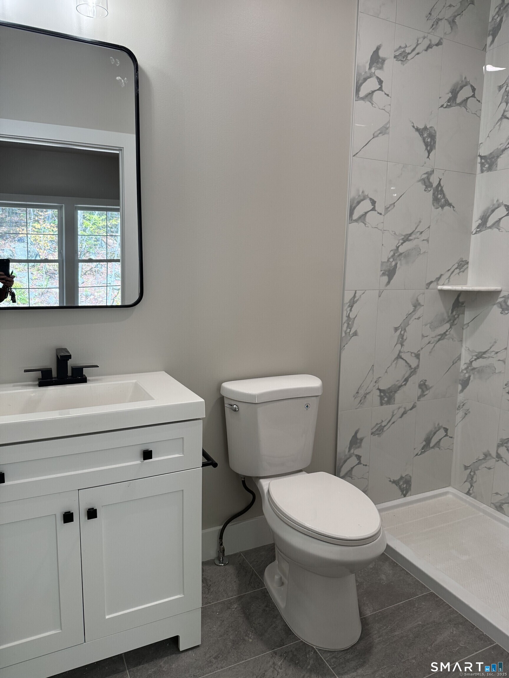 243 Echo Lake Road, Unit B10 Watertown, CT 06795 - Photo 10 of 10 a bathroom with a toilet sink and mirror