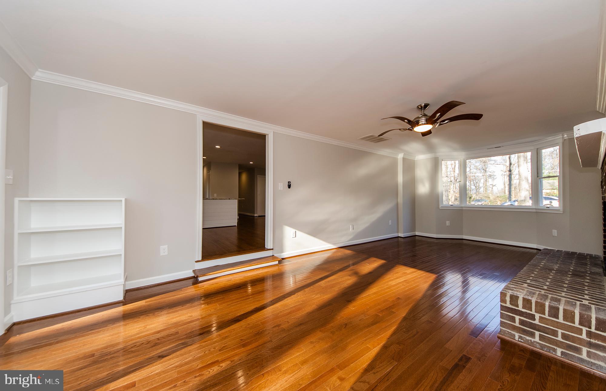 6620 Ridgeway Drive Springfield, VA 22150 - Photo 14 of 37 a view of an empty room with a window and wooden floor