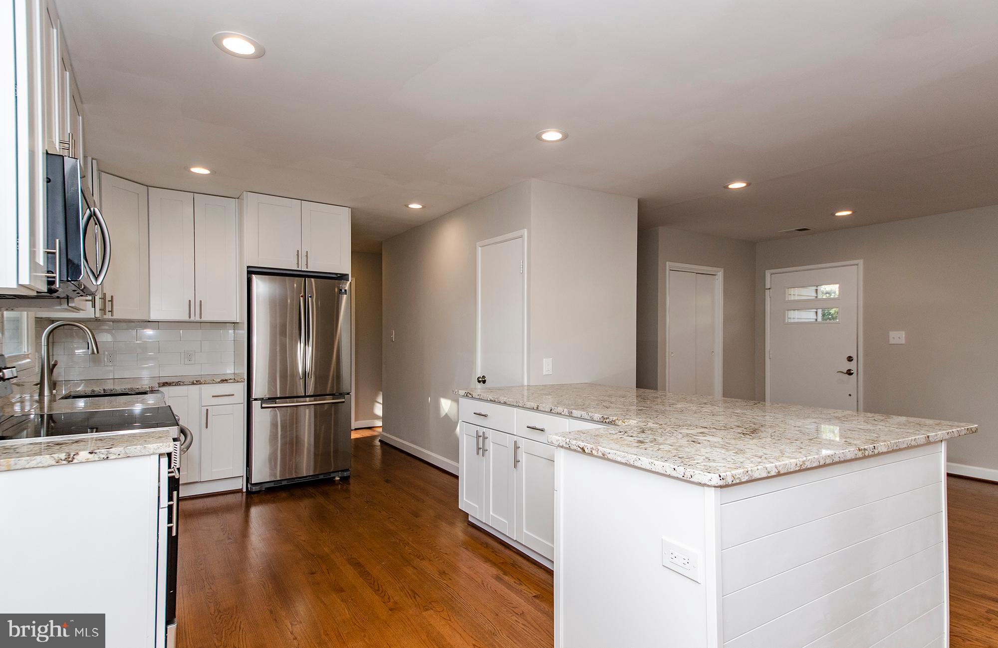 6620 Ridgeway Drive Springfield, VA 22150 - Photo 8 of 37 a kitchen with a refrigerator and a sink