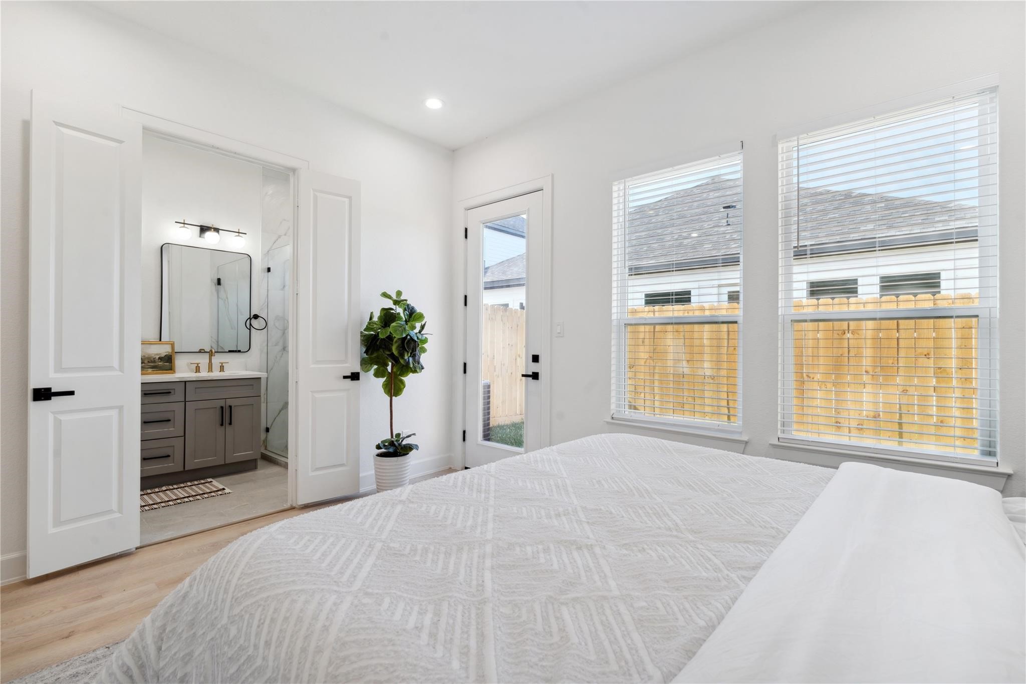 6528 Weston Street, Unit A Houston, TX 77021 - Photo 15 of 25 a bedroom with a bed and a large window