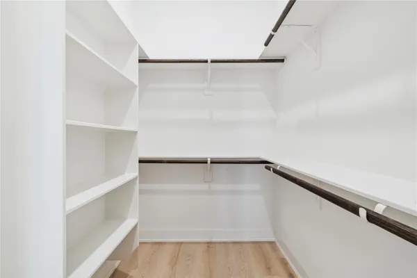 a view of an empty walk in closet