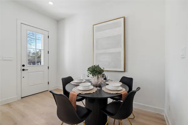 a view of a dining room with furniture and window