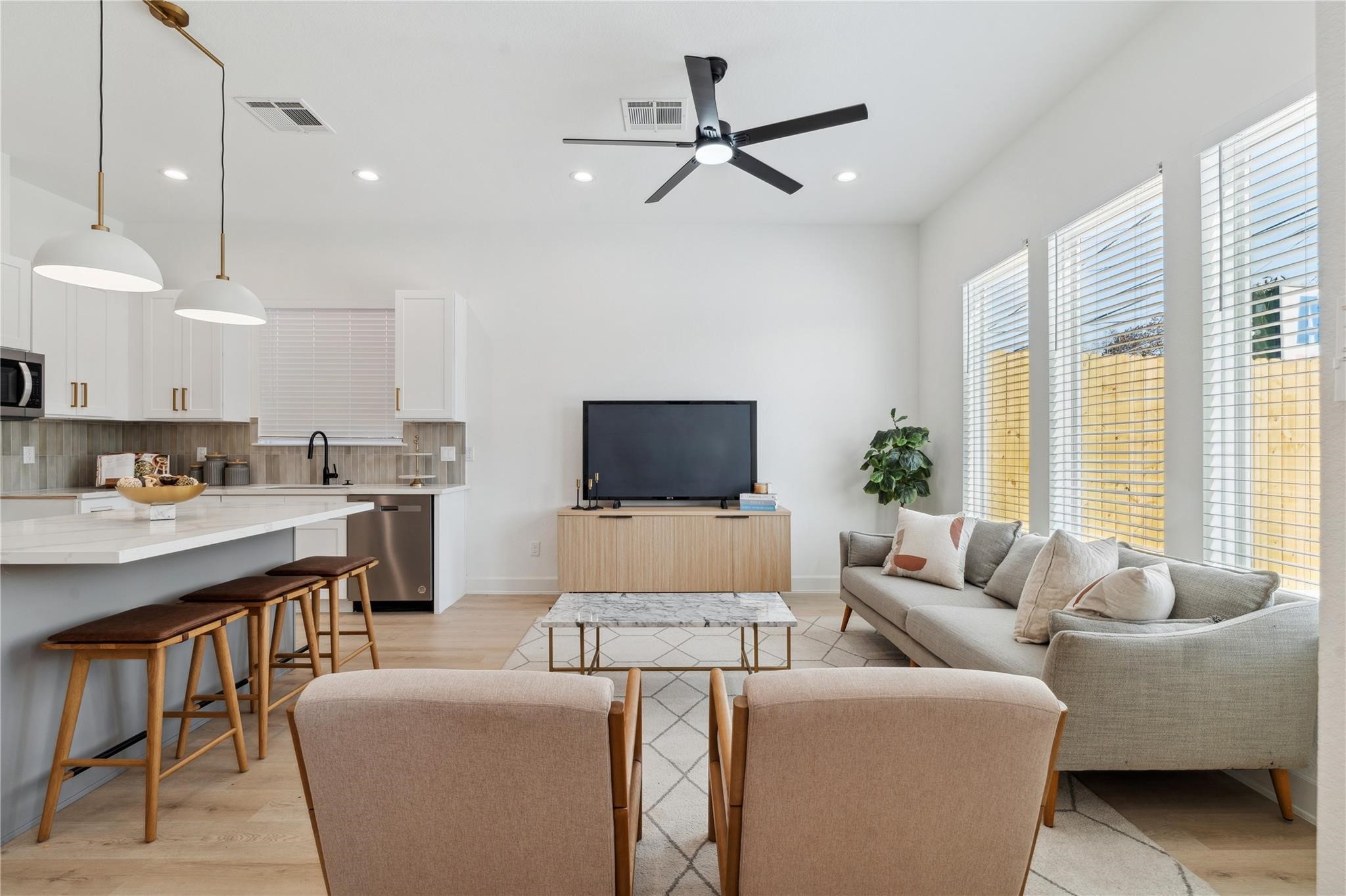 6528 Weston Street, Unit A Houston, TX 77021 - Photo 6 of 25 a living room with furniture and a flat screen tv